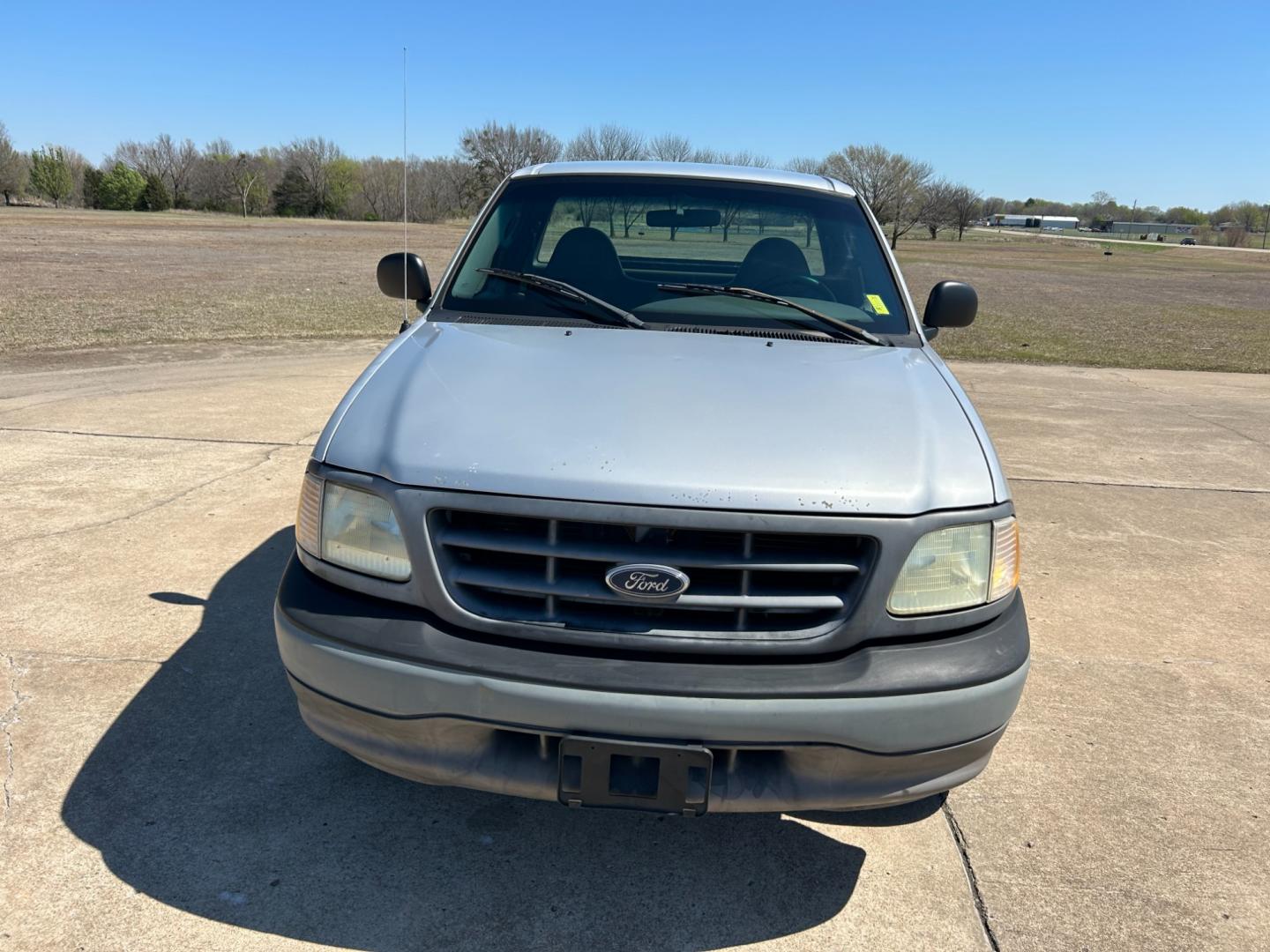 2003 GRAY /Gray Ford F-150 XL Long Bed 2WD (2FTPF17Z43C) with an 5.4L V8 SOHC 16V engine, AUTOMATIC transmission, located at 17760 Hwy 62, Morris, OK, 74445, (918) 733-4887, 35.609104, -95.877060 - 2003 FORD F-150 HAS THE 5.4 TRITON ENGINE AND IS 2WD. THIS TRUCK HAS MANUAL SEATS, MANUAL WINDOWS, MANUAL LOCKS, AMFM STEREO, CASSETTE PLAYER, BEDCOVER, ONLY 48,847 ACTUAL MILES!! CLEAN TITLE AND FREE CARFAX REPORT GOODYEAR 245/75R16 TIRES ***DOES HAVE SOME RUST AND PAINT DAMAGE AS SHOWN IN THE PI - Photo#1